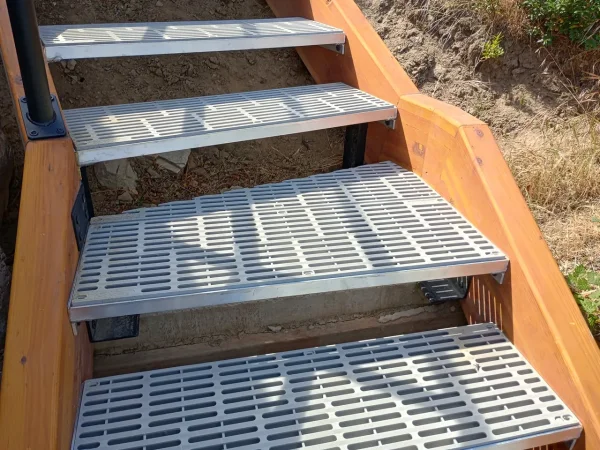 Custom Concrete-Backed Staircase with Glulam Beams - Image 2 by Cabe Construction, LLC