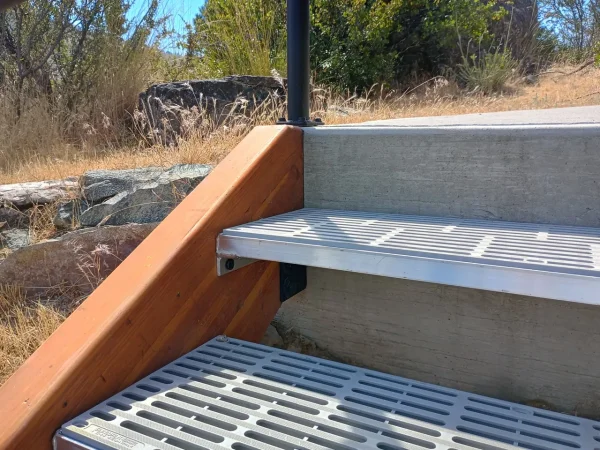 Custom Concrete-Backed Staircase with Glulam Beams - Image 3 by Cabe Construction, LLC