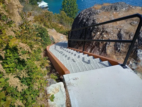 Custom Concrete-Backed Staircase with Glulam Beams - Image 4 by Cabe Construction, LLC