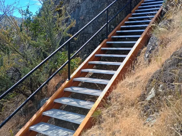 Custom Concrete-Backed Staircase with Glulam Beams - Image 5 by Cabe Construction, LLC